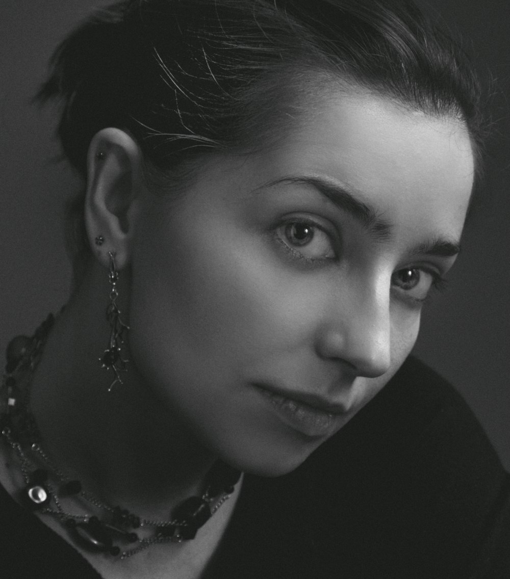 woman in black shirt wearing silver necklace