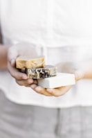 person holding brown and white chocolate bar