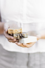 person holding brown and white chocolate bar