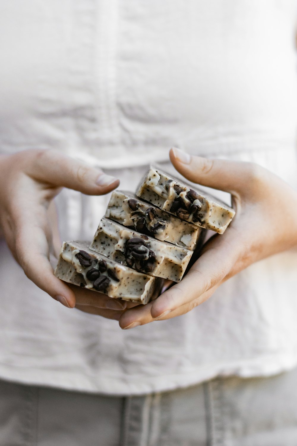 person holding brown and white chocolate bar