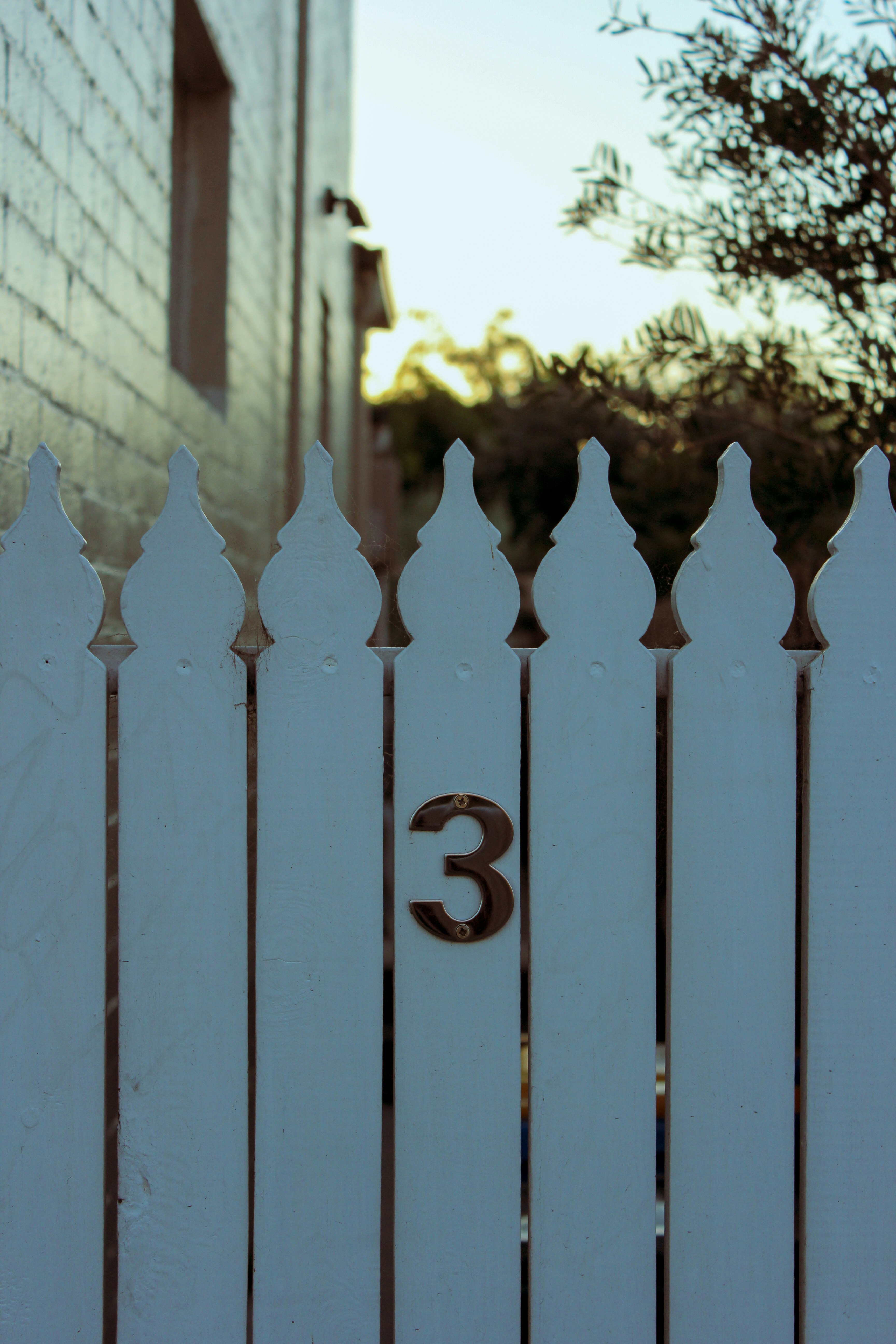 blue wooden fence with number 2