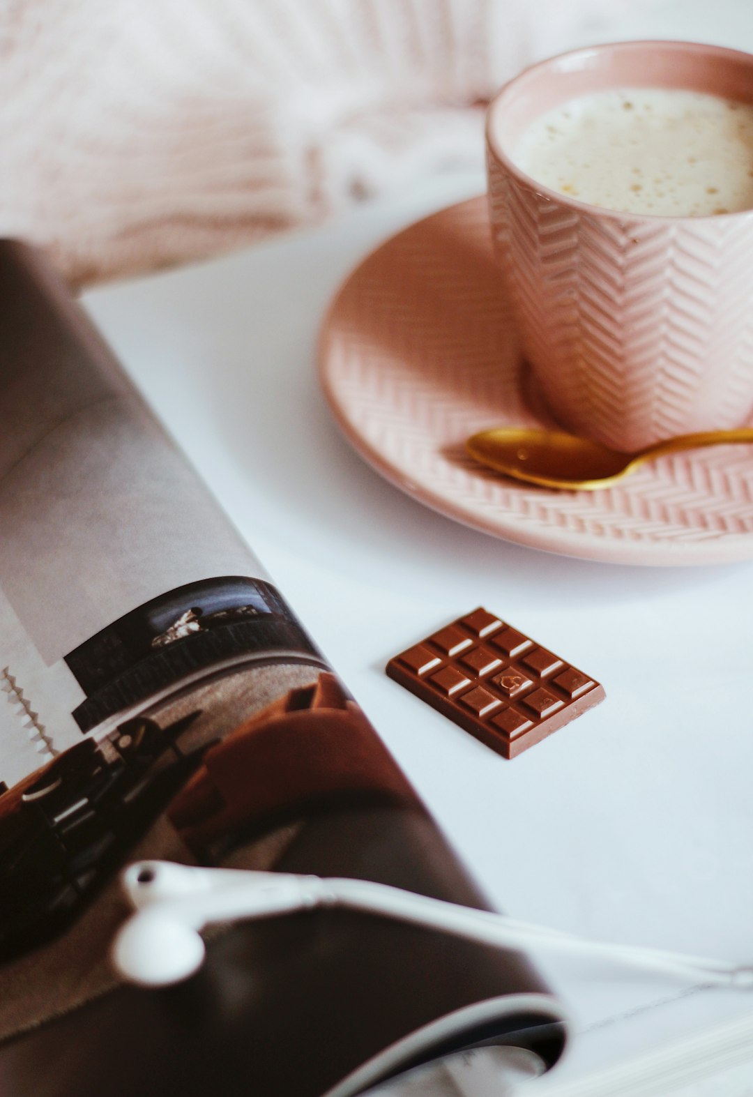 white and brown disposable cup on white ceramic plate