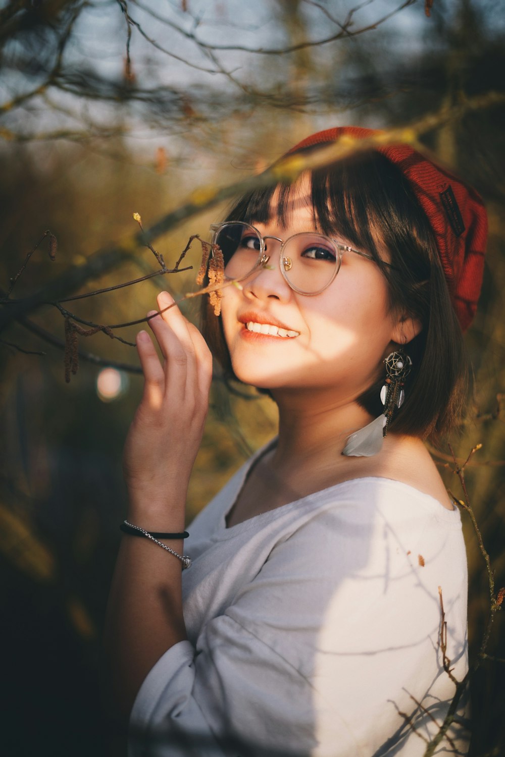 woman in white tank top wearing black framed eyeglasses