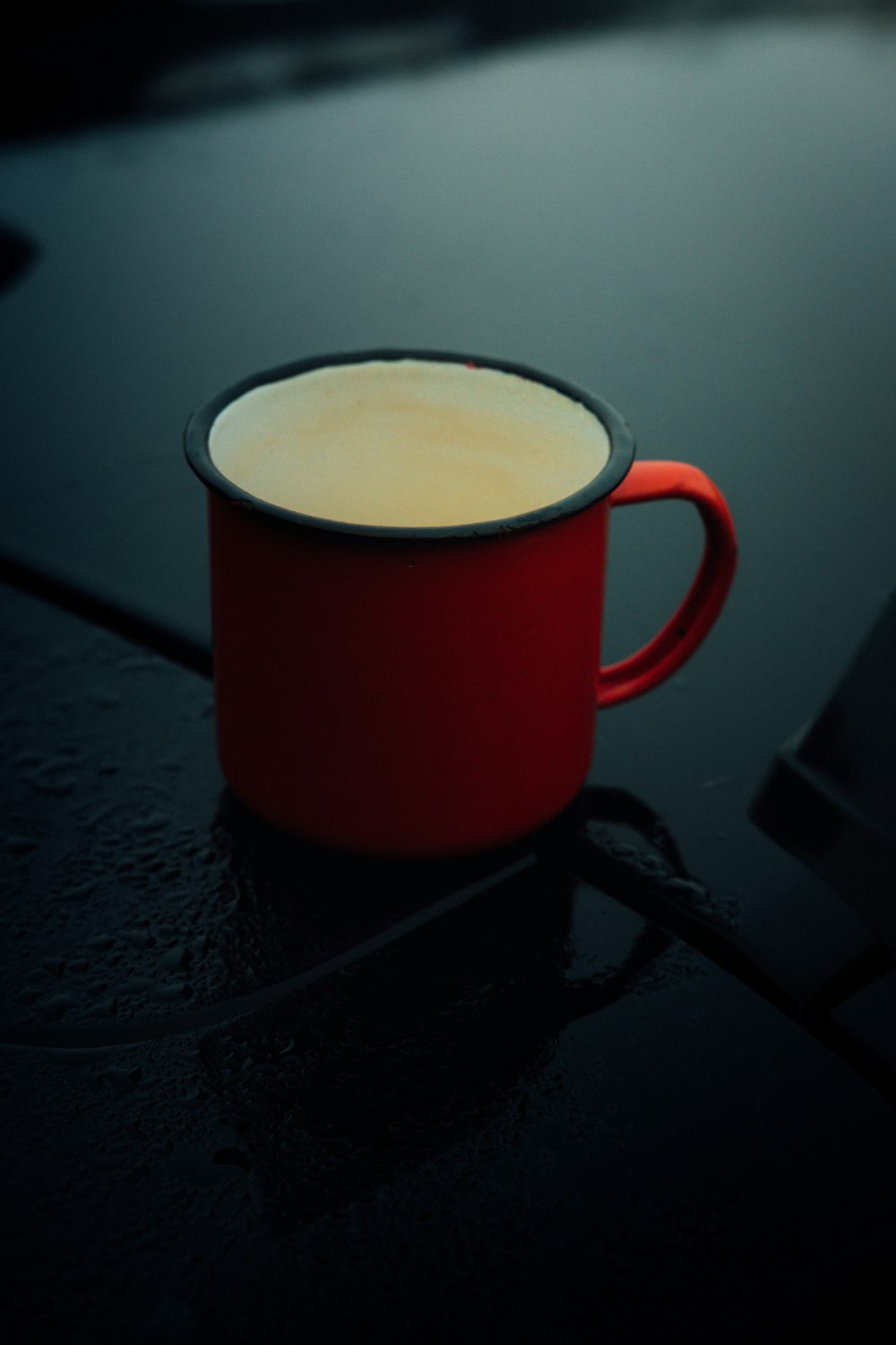 red and white ceramic mug