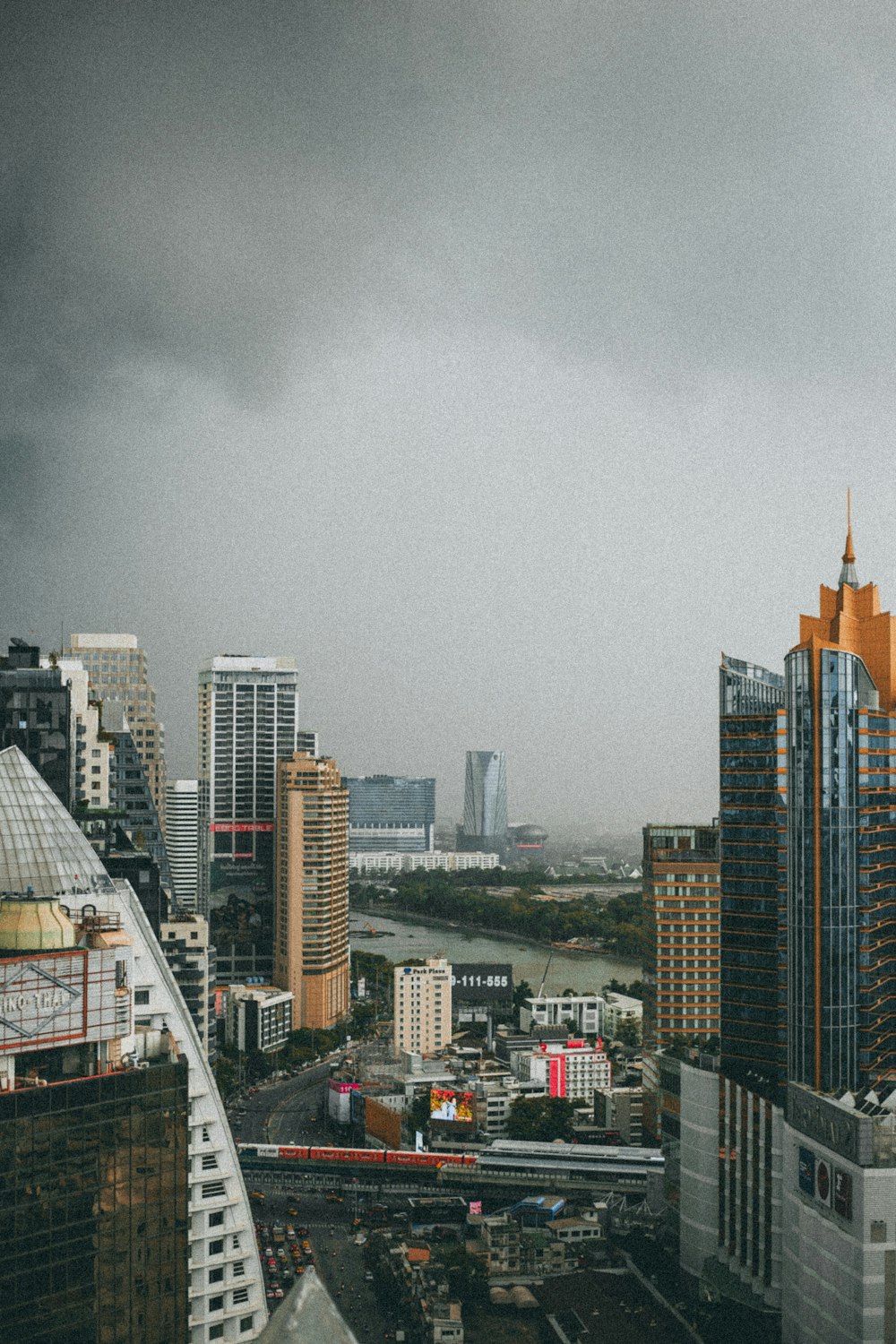 high rise buildings under gray sky