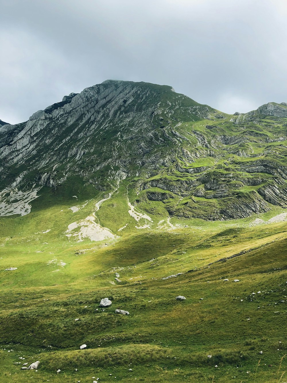 green and gray mountains under white sky during daytime