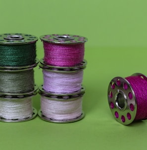 purple green and silver round coins