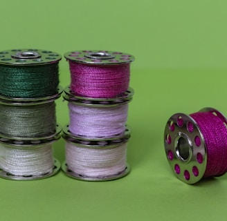 purple green and silver round coins