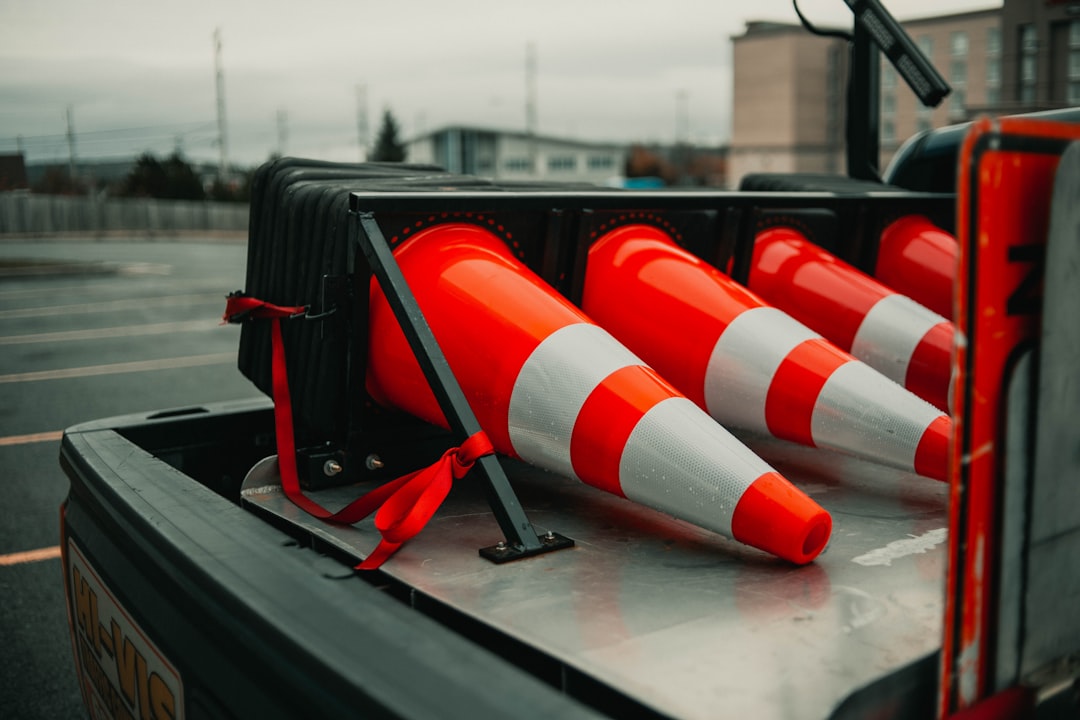 white and orange traffic cone on black bag