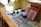 white and black cat on brown wooden shelf