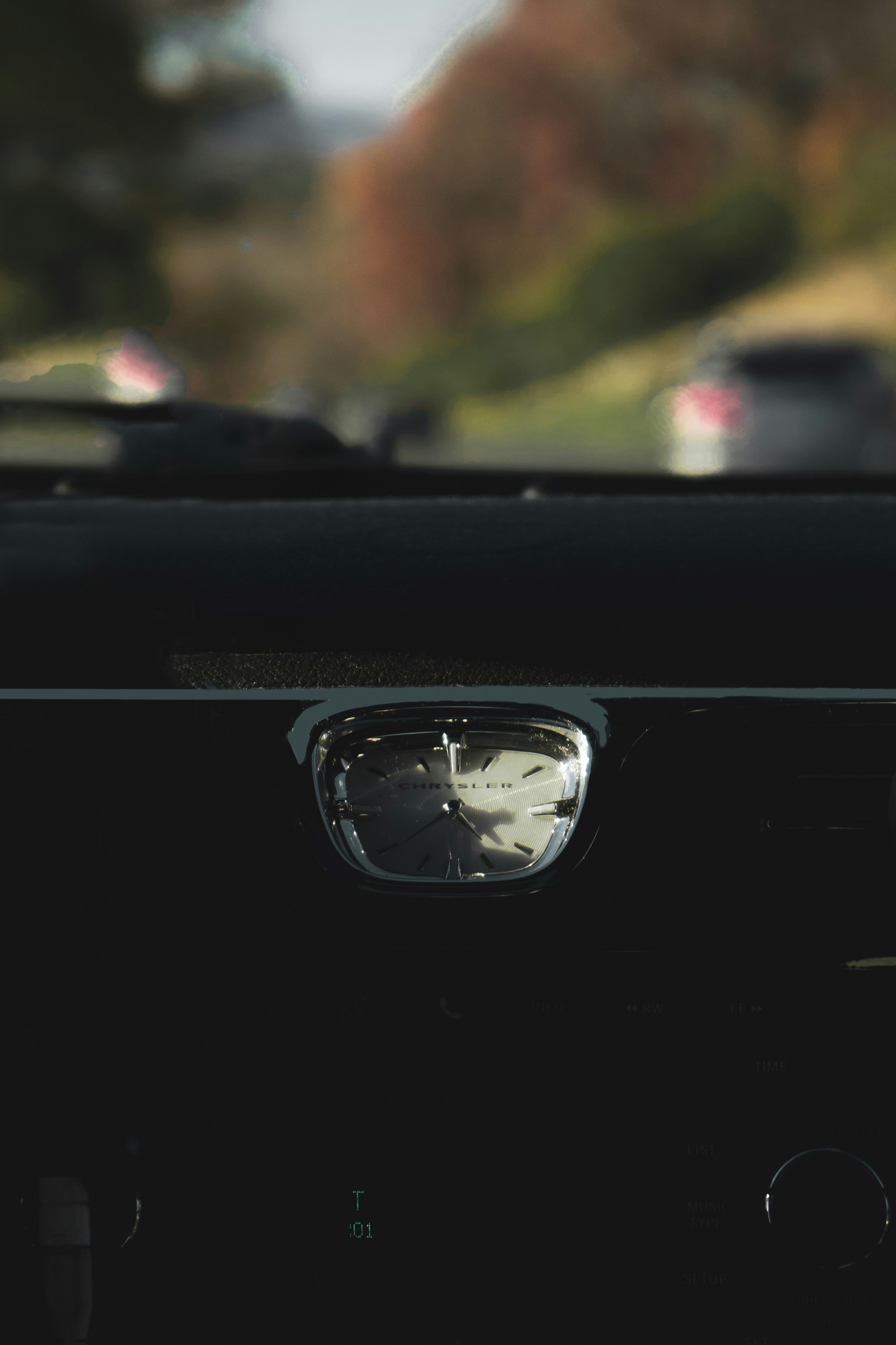 black car with white and black round analog watch