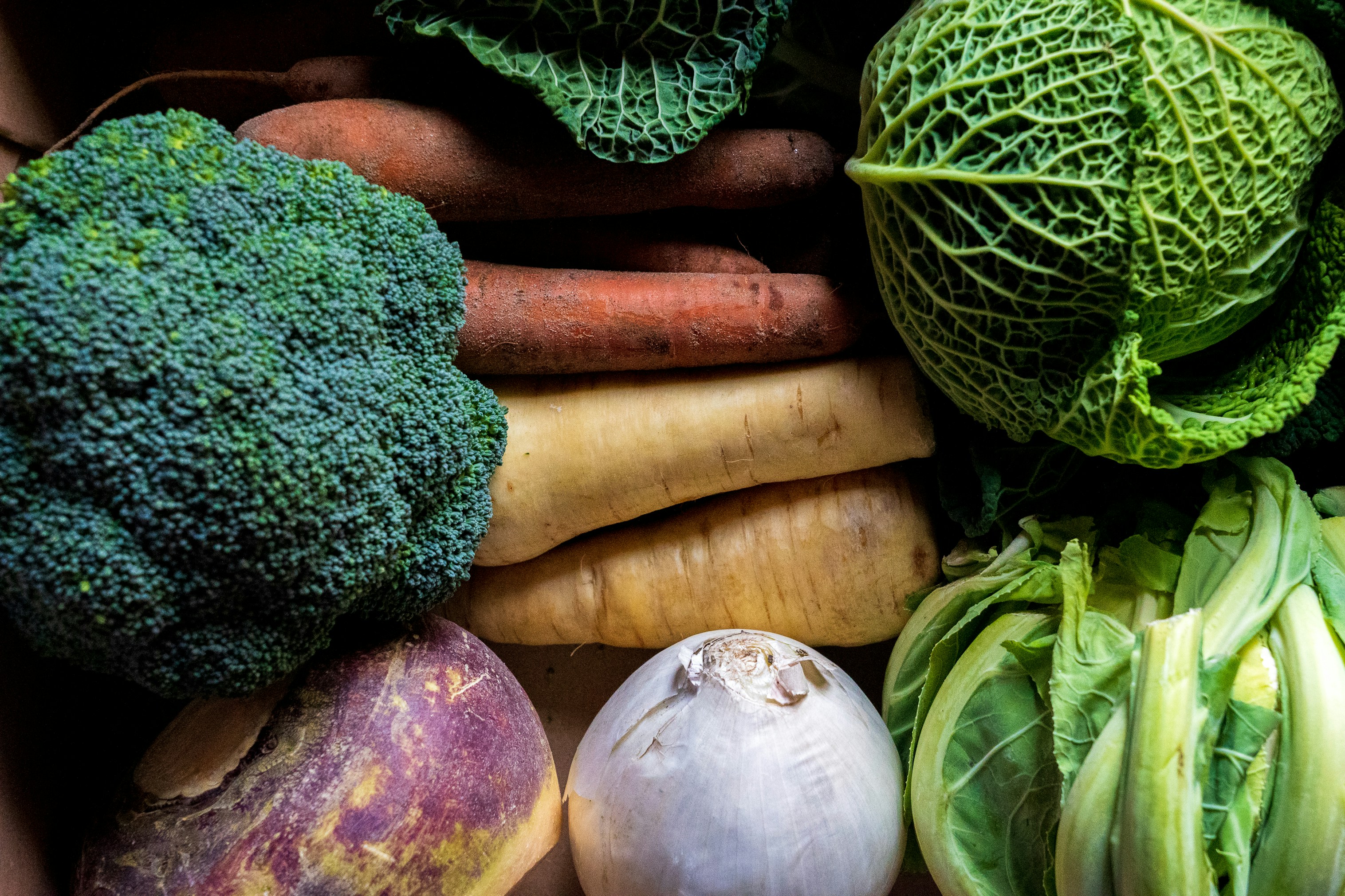 green-and-brown-vegetables-on-brown-wooden-table