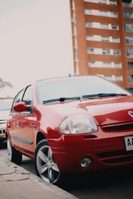 red bmw m 3 parked on street during daytime