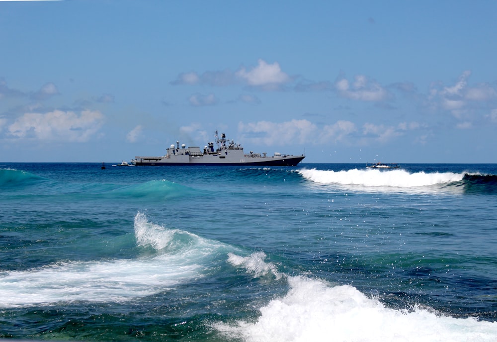 white and black ship on sea during daytime