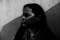 grayscale photo of woman in scarf