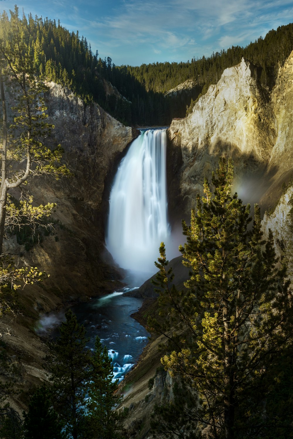 waterfalls in the middle of the forest