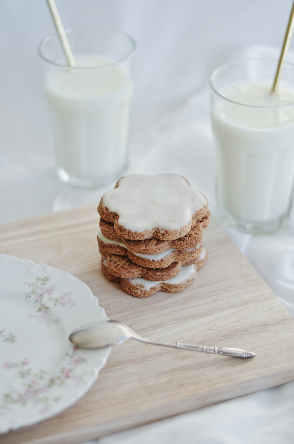 cookies on white ceramic plate beside stainless steel fork
