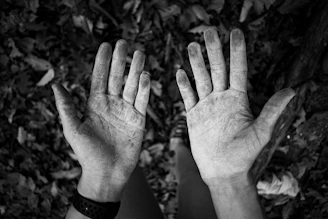 grayscale photo of persons left hand