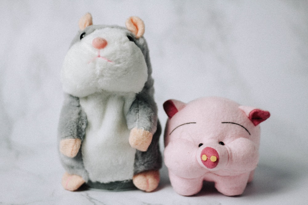 white and gray animal plush toy