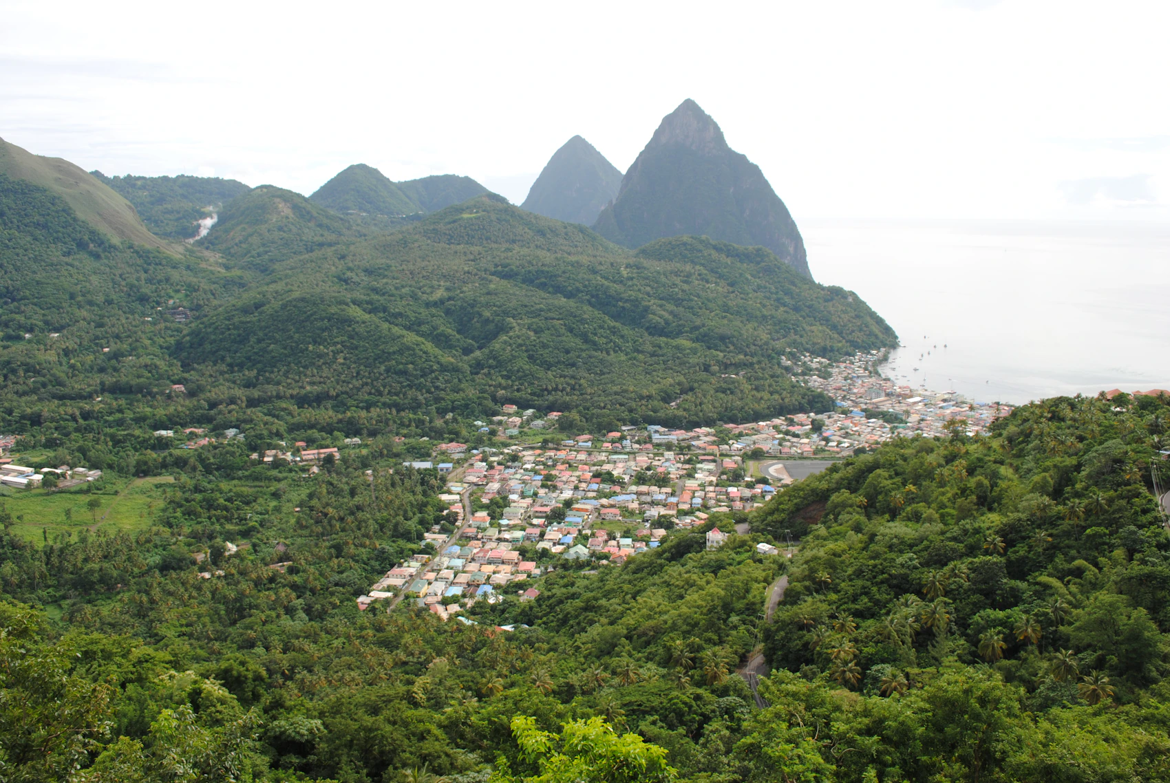 Soufrière and the Pitons spread through dense green volcanic terrain beside the sea