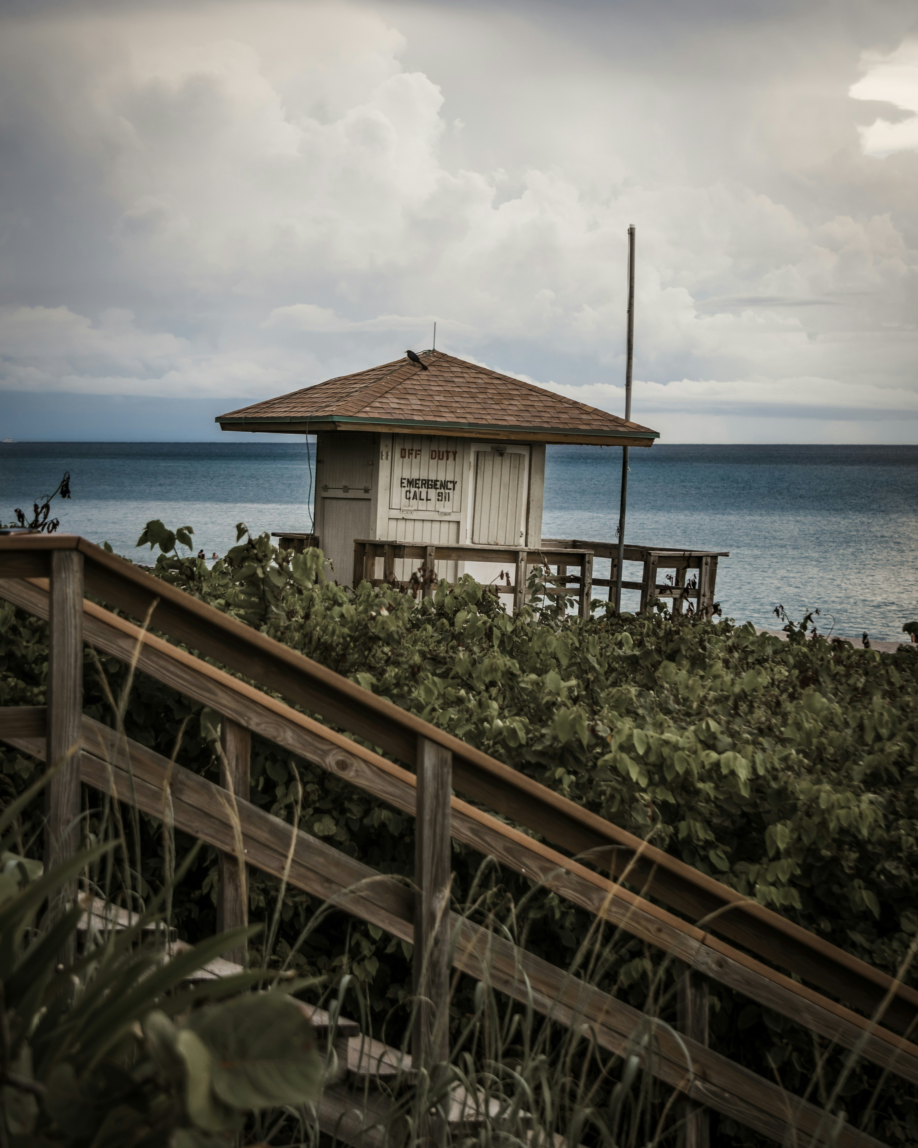 Brown wooden house near body of water during daytime photo – Free ...