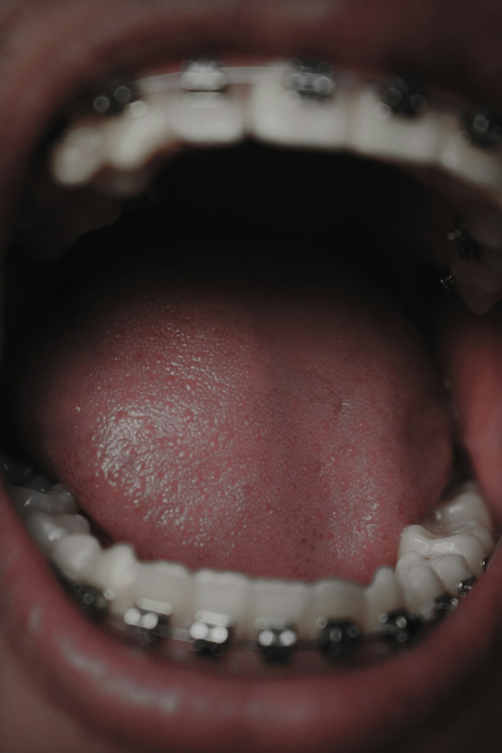 persons mouth open in close up photography