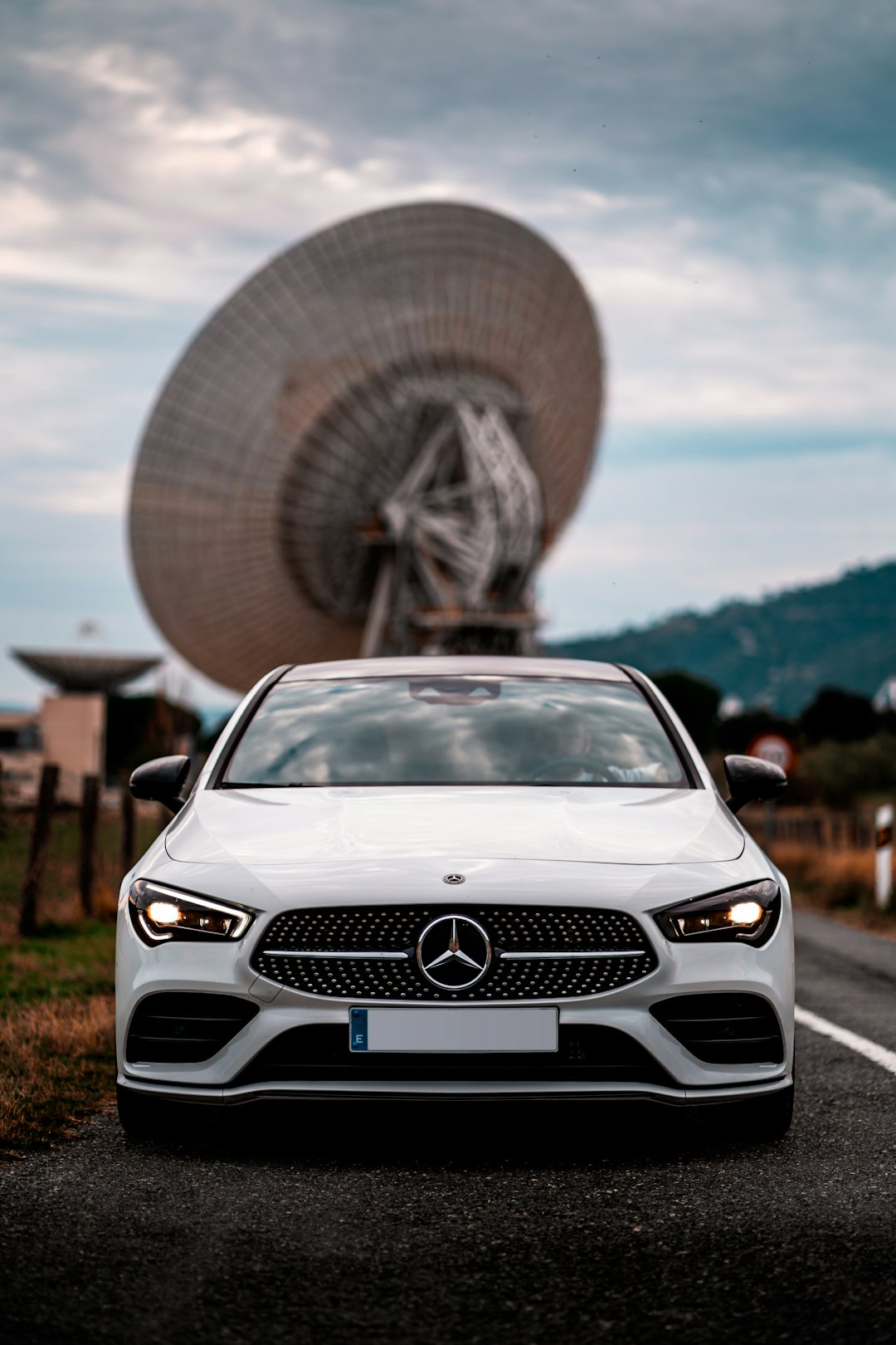 silver mercedes benz c class parked on road during daytime