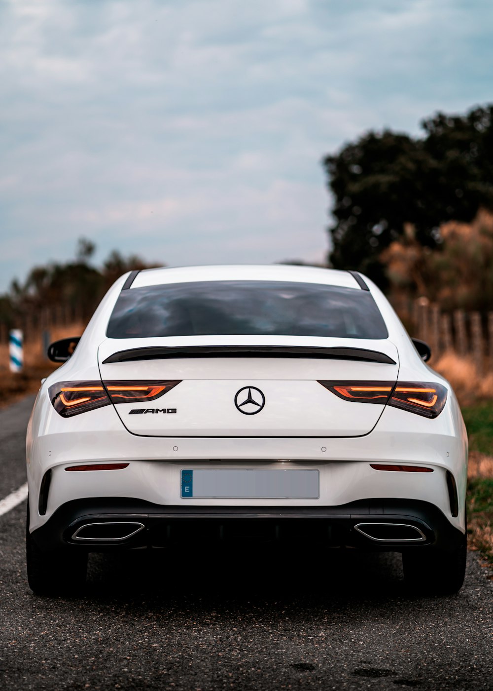 white bmw m 3 on road during daytime