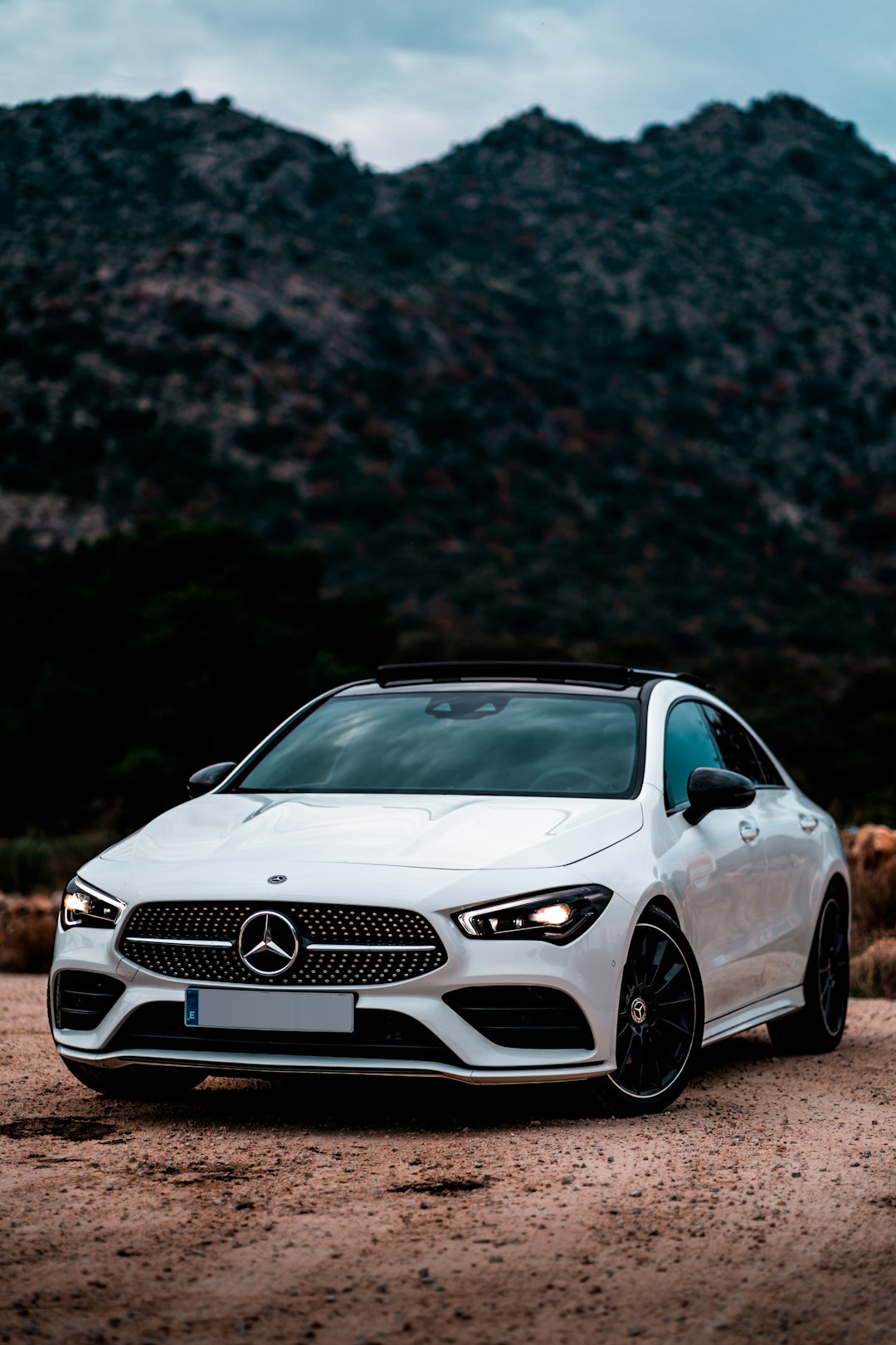 white mercedes benz coupe on road during daytime