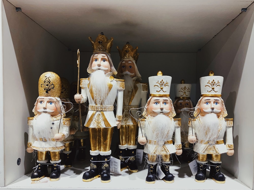 gold and white ceramic figurines