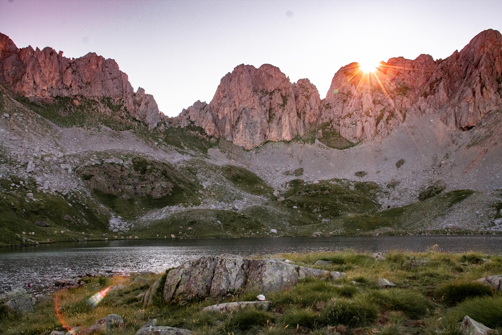 brown and gray mountains near body of water during daytime