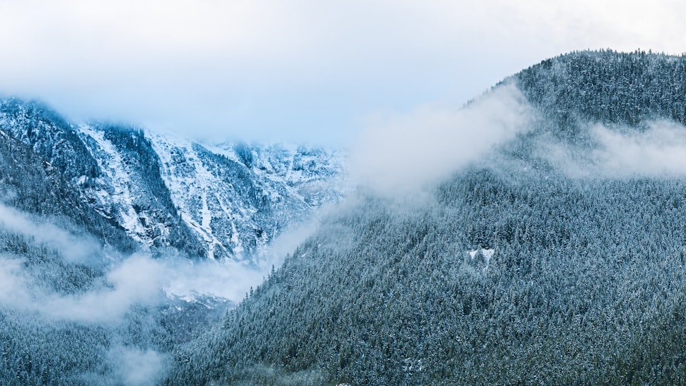 snow covered mountain under white sky during daytime