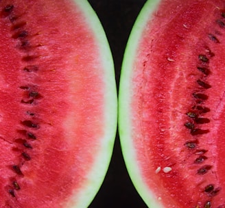 sliced watermelon on black surface