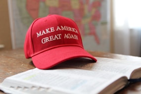 a red hat that reads make america great again