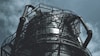 black metal spiral staircase under blue sky during daytime