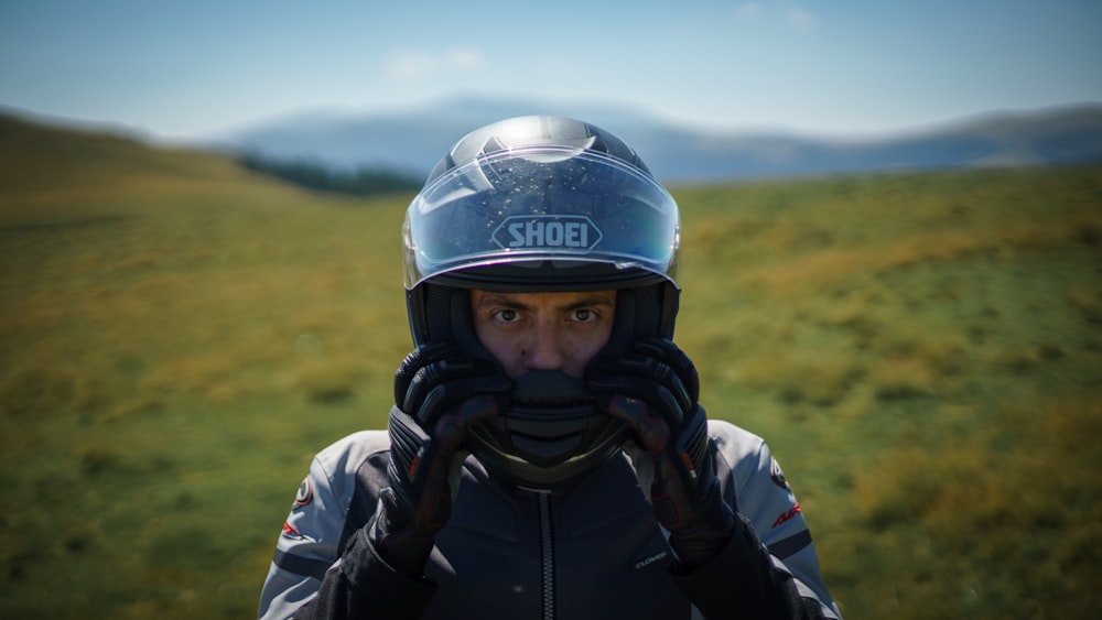 man in black and white jacket wearing helmet