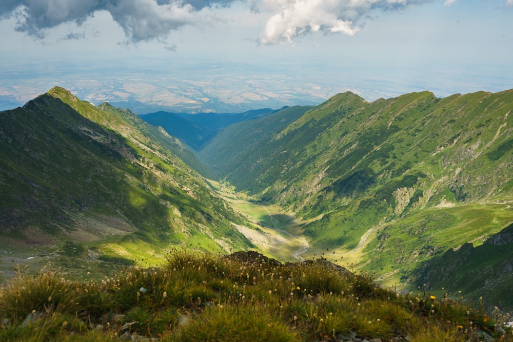 green mountains under white clouds during daytime