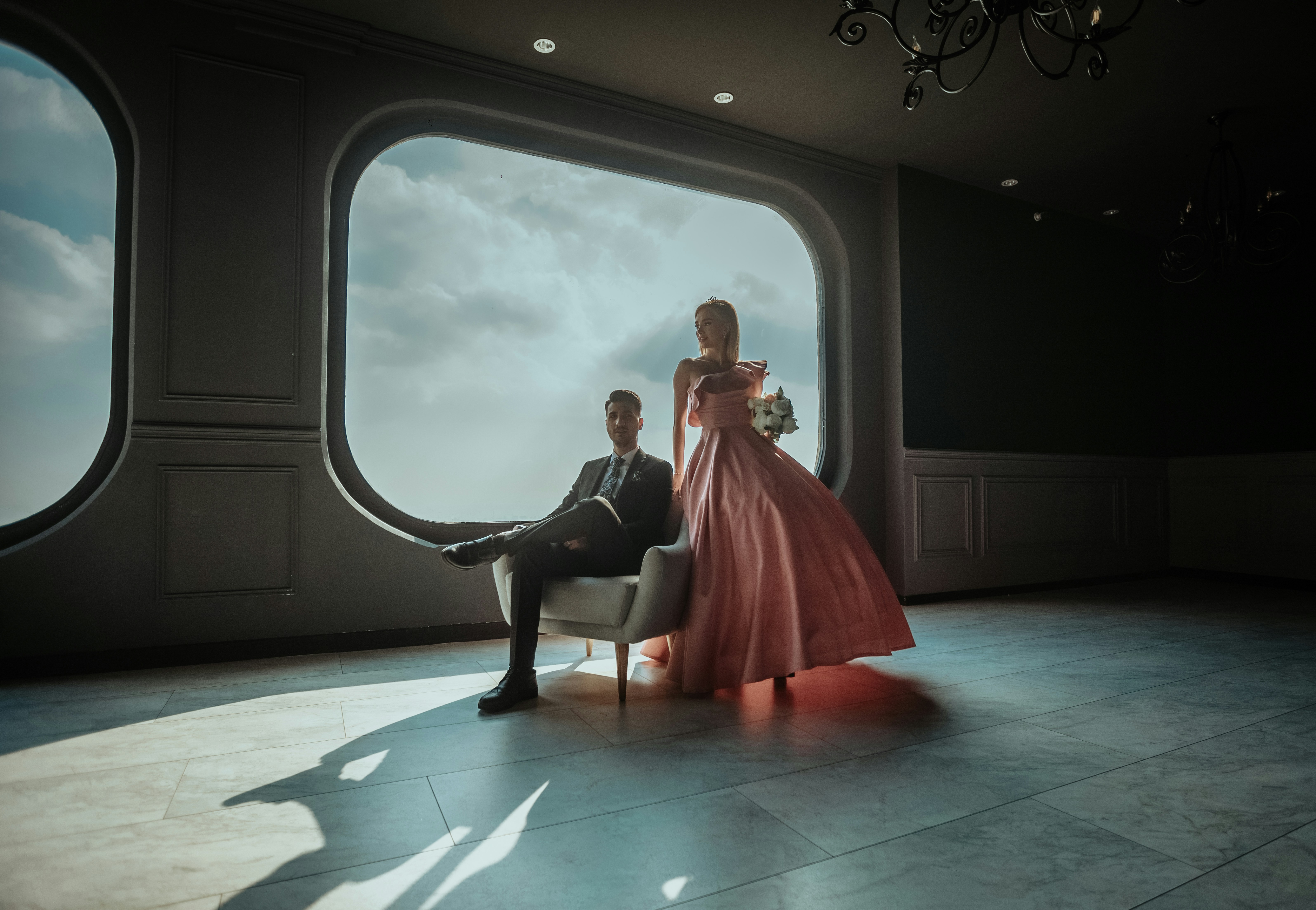 woman in red dress sitting on black chair