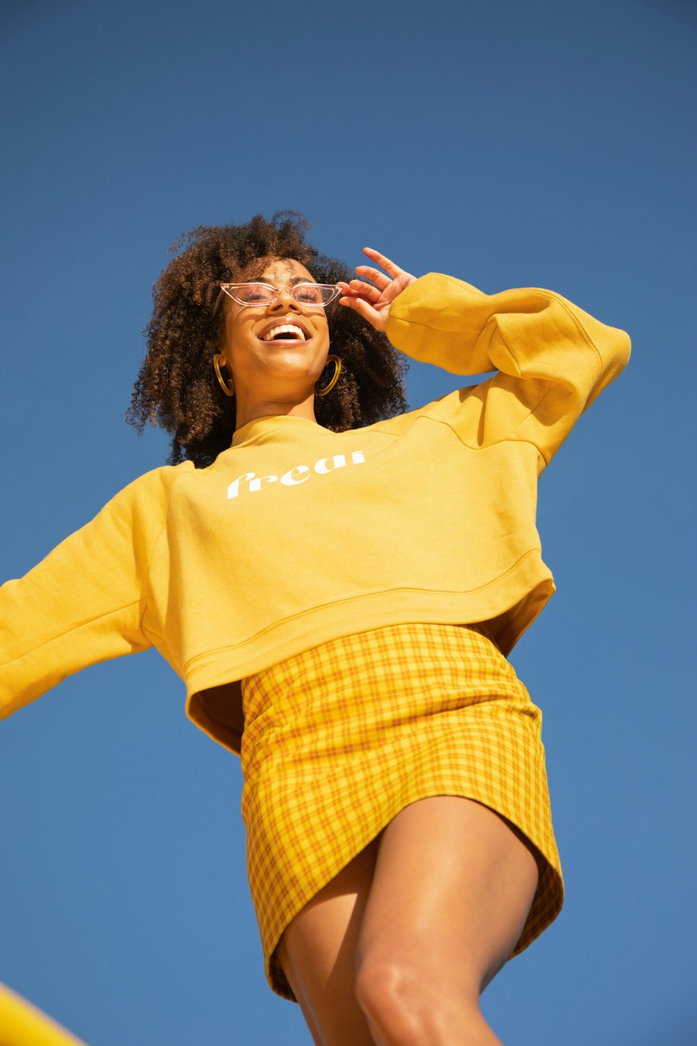 woman in yellow long sleeve shirt