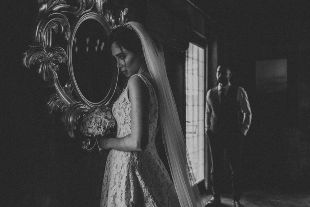 grayscale photo of woman in white floral dress