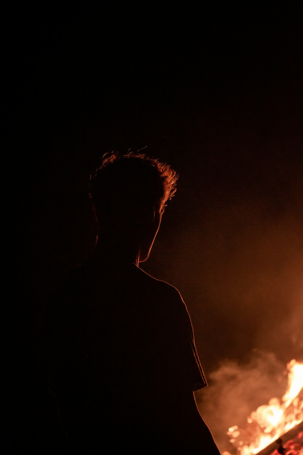 silhouette of man with smoke on his head