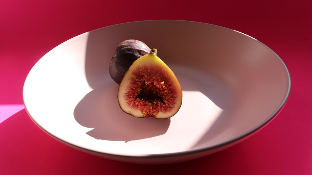 sliced fruit on white ceramic plate