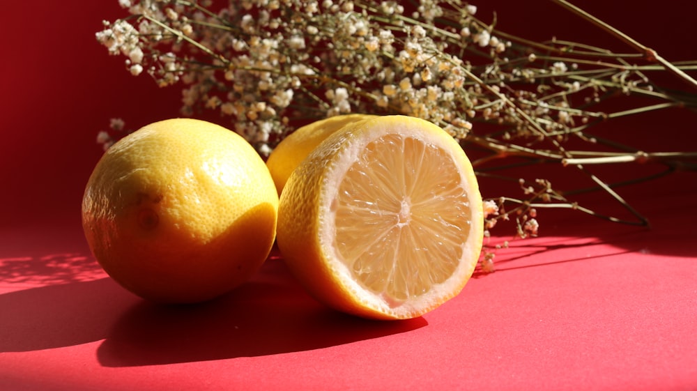 yellow lemon fruit on red textile