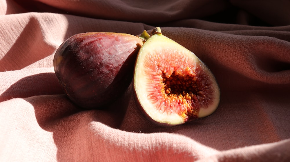 red and green fruit on black leather textile