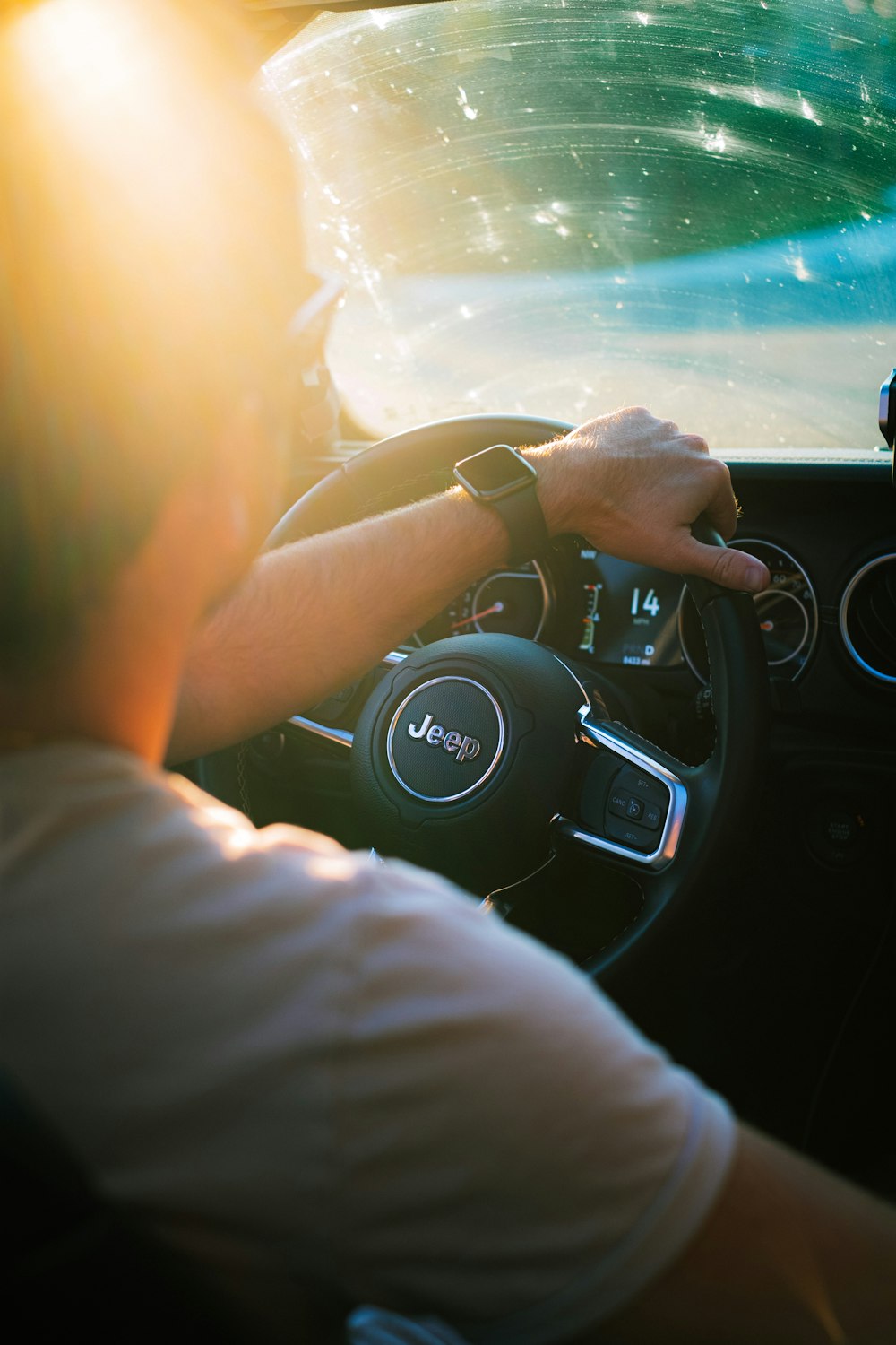 person driving car during daytime