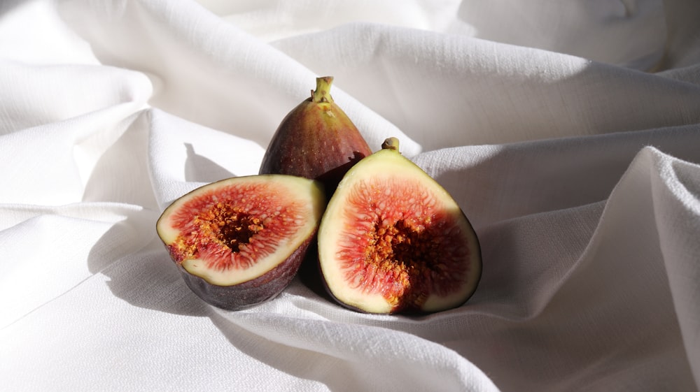 brown and green fruit on white textile