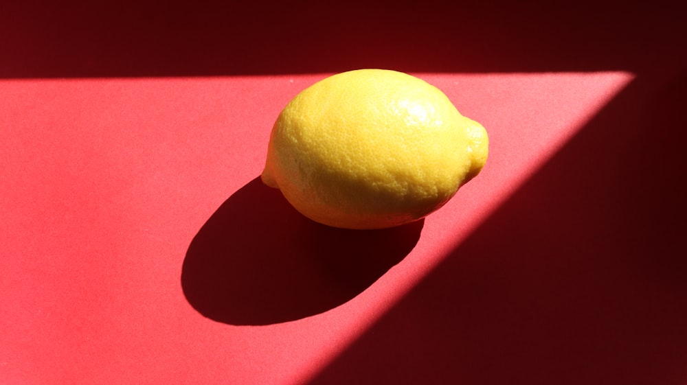 yellow lemon on purple textile