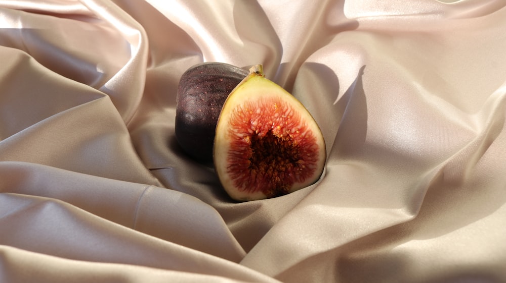 black round fruit on white textile