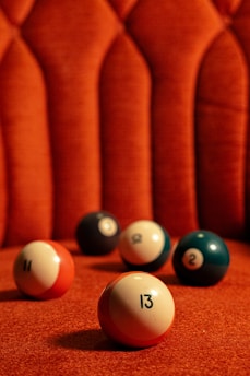 white and green billiard ball