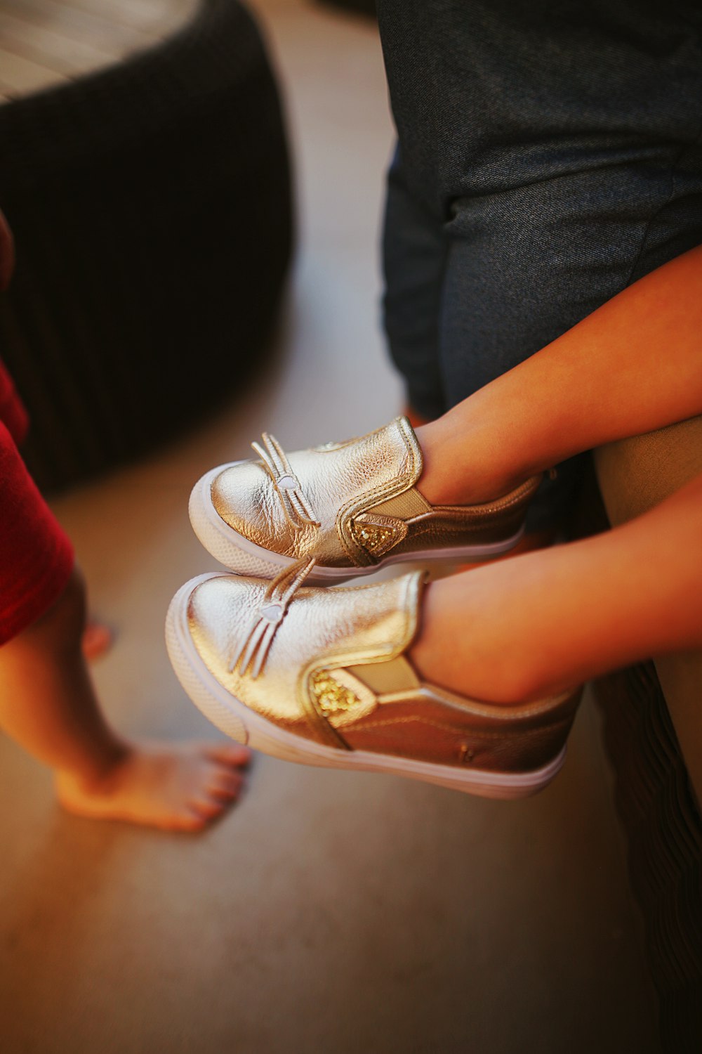 person wearing white and brown sandals